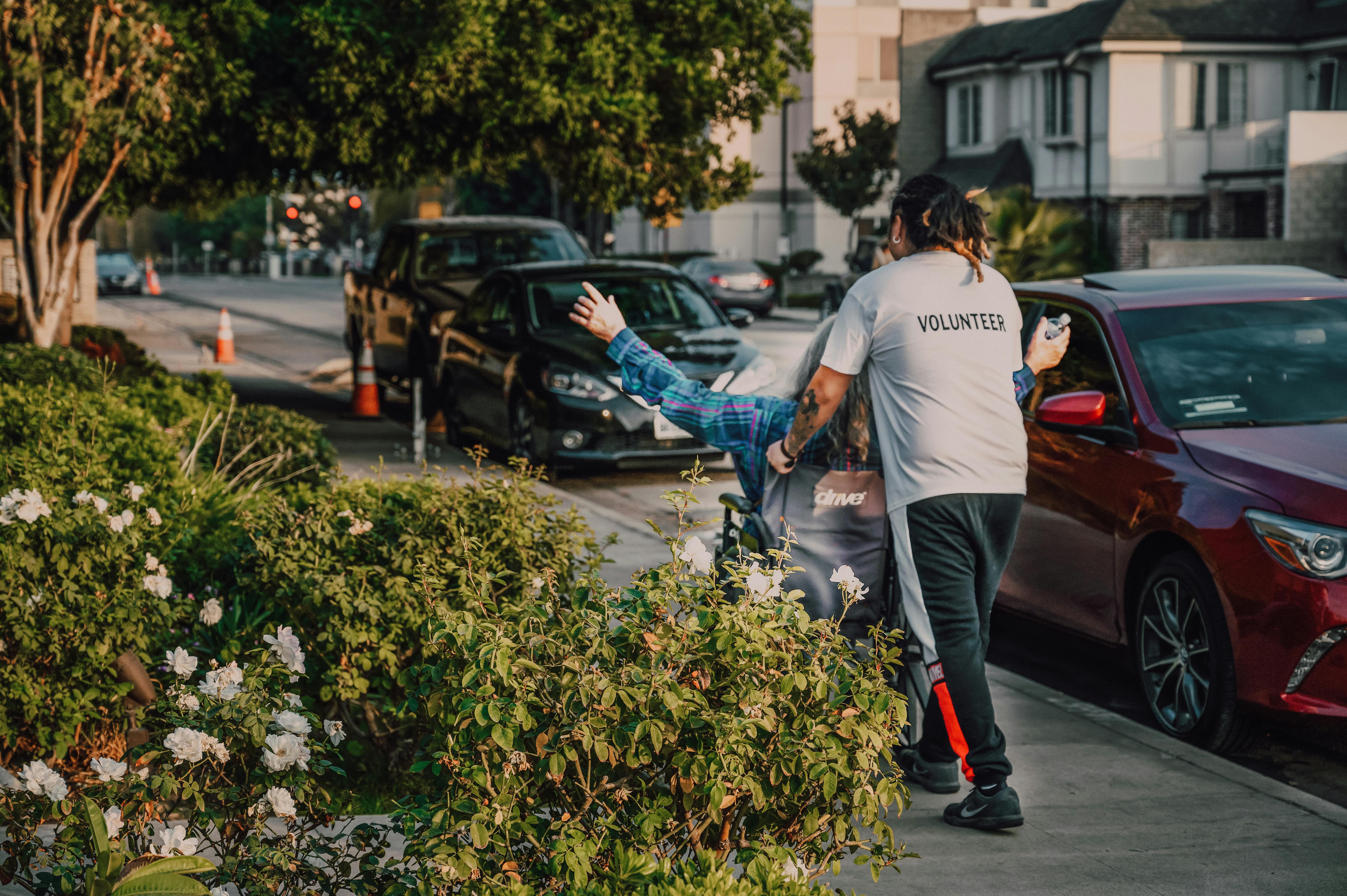 Volunteer helping someone in the community